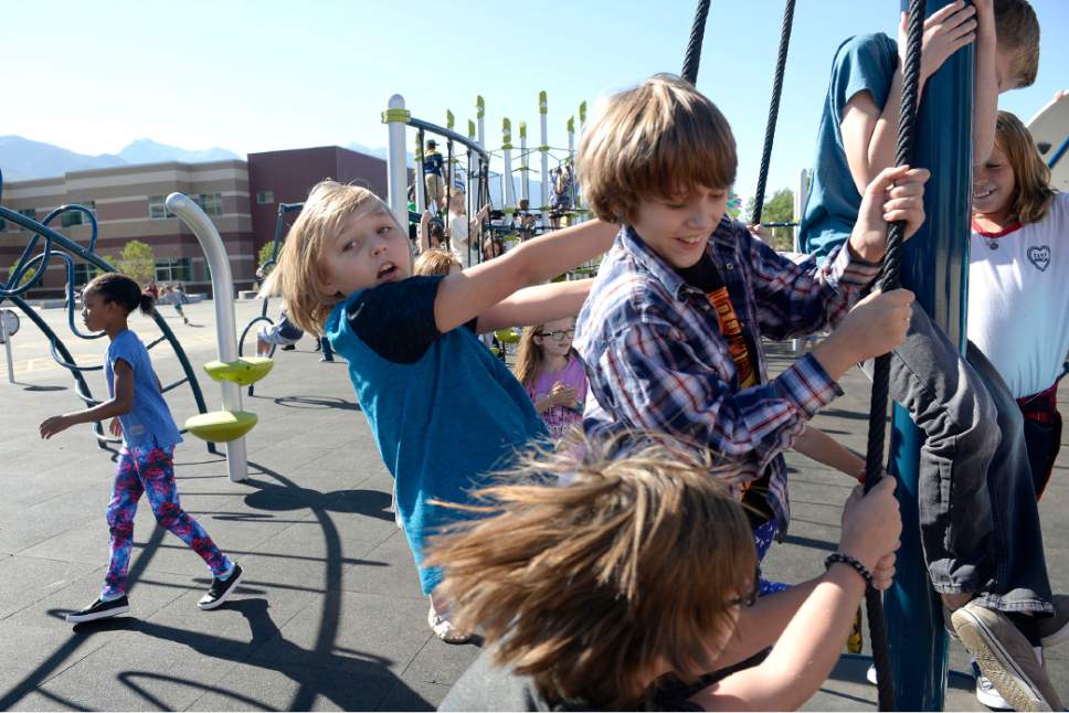Al Hartmann  |  The Salt Lake Tribune
The playground at the brand new Butler Elementary in Cotonwood Heights has modern equipment to engage physical activity like climbing features.  It is one of hundreds of schools that opened Wednesday as students gear up for the 2016-2017 school year.