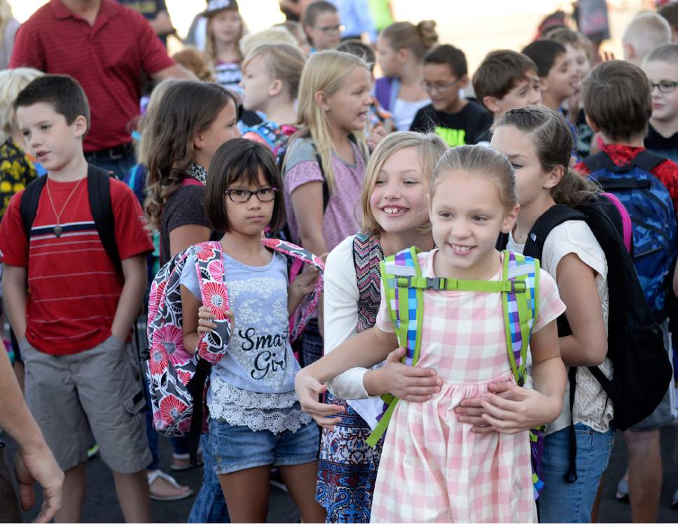 Al Hartmann  |  The Salt Lake Tribune
Students line up by classroom and old classmates meet again at the brand new Butler Elementary in Cotonwood Heights Wenesday March 25.  It is one of hundreds of schools that opened Wednesday as students gear up for the 2016-2017 school year.