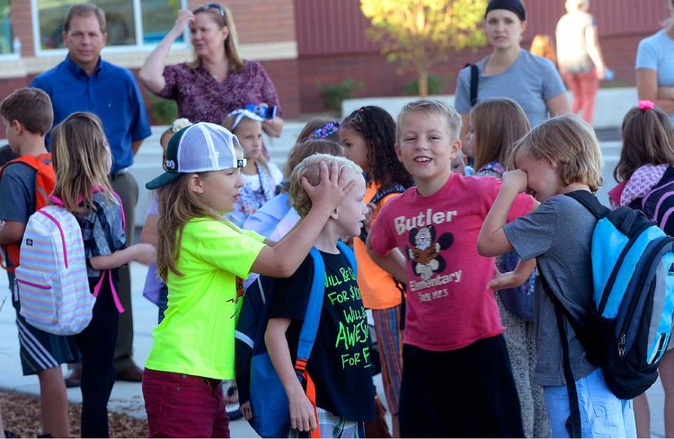 Al Hartmann  |  The Salt Lake Tribune
Students line up by classroom and old classmates meet again at the brand new Butler Elementary in Cotonwood Heights Wenesday March 25.  It is one of hundreds of schools that opened Wednesday as students gear up for the 2016-2017 school year.