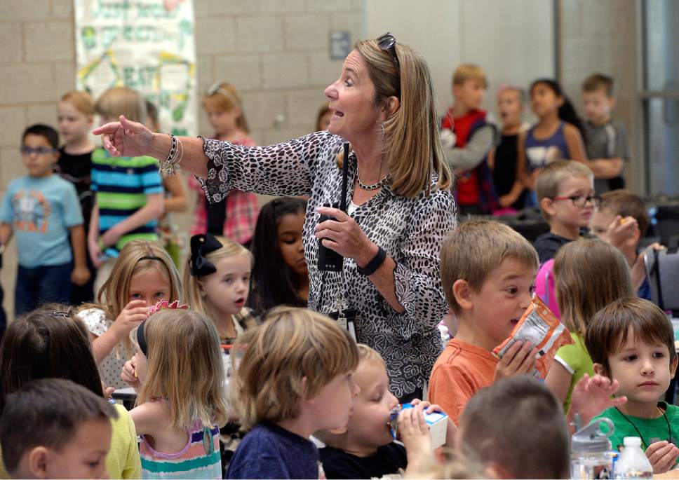 Al Hartmann  |  The Salt Lake Tribune
Principal Christy Waddell runs traffic control and gets students seated during first lunch in the cafeteria at the brand new Butler Elementary in Cotonwood Heights Wenesday March 25.  It is one of hundreds of schools that opened Wednesday as students gear up for the 2016-2017 school year.