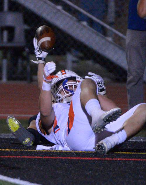 Leah Hogsten  |  The Salt Lake Tribune
Alta's Josh Davis pulls down a touchdown putting Alta in the lead 25-24. Fifth-ranked Alta High School defeated third-ranked Timpview High School during their Region 7 game, September 9, 2016.