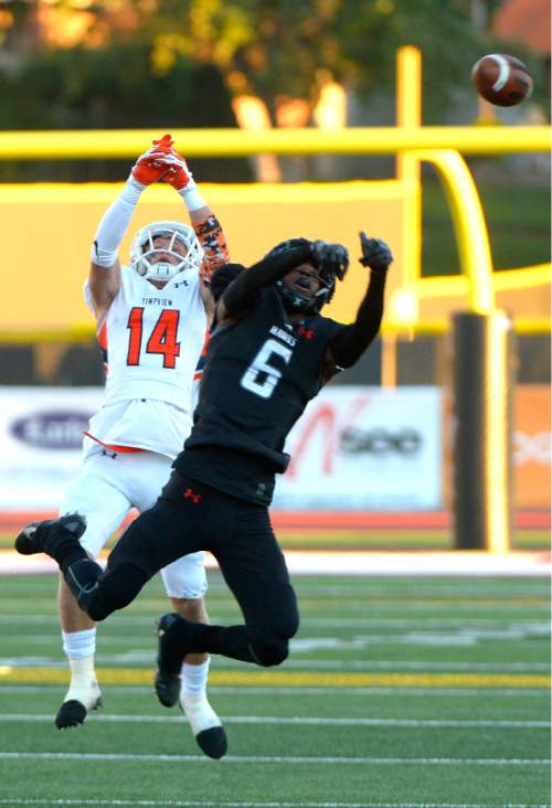 Leah Hogsten  |  The Salt Lake Tribune
Timpview's Niles Herrod cannot pull down the catch as Alta's Tyler Hill blocks him.  Third-ranked Timpview High School leads fifth-ranked Alta High School 24-6 at the half during their Region 7 game, September 9, 2016.