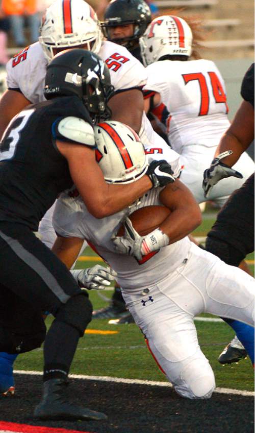 Leah Hogsten  |  The Salt Lake Tribune
Timpview's Alema T te'o pushes past Alta's Mitch Medina into the end zone. Third-ranked Timpview High School leads fifth-ranked Alta High School 24-6 at the half during their Region 7 game, September 9, 2016.