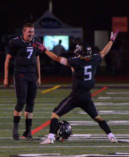 Leah Hogsten  |  The Salt Lake Tribune
Alta quarterback Will Dana celebrates the win with  London Rockwood. Fifth-ranked Alta High School defeated third-ranked Timpview High School during their Region 7 game, September 9, 2016.