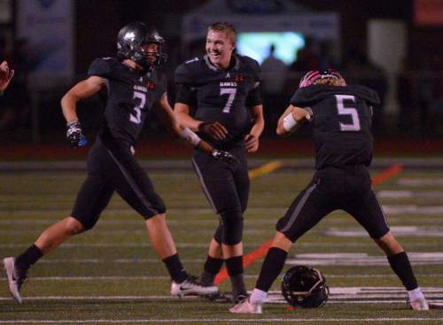 Leah Hogsten  |  The Salt Lake Tribune
Alta quarterback Will Dana celebrates the win with Landon Maxfield and London Rockwood. Fifth-ranked Alta High School defeated third-ranked Timpview High School during their Region 7 game, September 9, 2016.