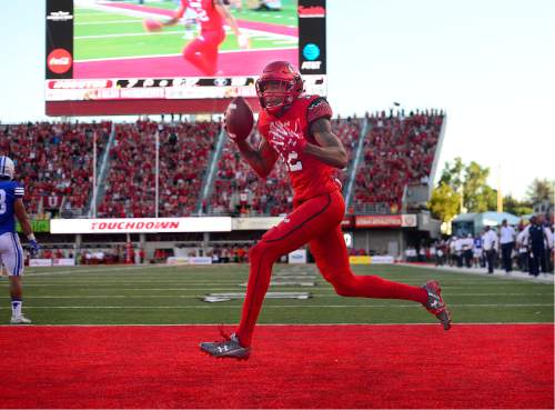 Scott Sommerdorf   |  The Salt Lake Tribune  
Utah WR Tim Patrick runs through the end zone after his TD catch to give the Utes the lead back prior to the half. Utah led BYU 14-13 at the half, Saturday, September 10, 2016.