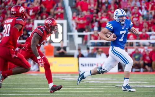 Rick Egan  |  The Salt Lake Tribune

Brigham Young quarterback Taysom Hill (7) outruns his defenders, Utah Utes defensive back Marcus Williams (20) and defensive end Pita Taumoepenu (50), as he runs for a cougar touchdown, in second quarter action, BYU vs. Utah at Rice-Eccles Stadium, Saturday, September 10, 2016.