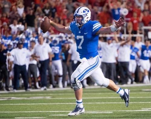 Rick Egan  |  The Salt Lake Tribune

Brigham Young quarterback Taysom Hill (7) runs for a touchdown for the Cougars, bringing BYU with in one point of Utah,in football action, at Rice-Eccles Stadium, Saturday, September 10, 2016.