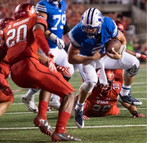 Rick Egan  |  The Salt Lake Tribune

Brigham Young Cougars quarterback Taysom Hill (7) tries to get past Utah Utes defensive back Marcus Williams (20) after breaking a tackle by Utah Utes linebacker Cody Barton (30), Williamns stopped him from scoring the 2-point conversion, resulting in a Utah 20-19 win over BYU, in football action, at Rice-Eccles Stadium, Saturday, September 10, 2016.