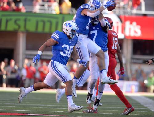 Scott Sommerdorf   |  The Salt Lake Tribune  
BYU players celebrate recovering a fumble by Utah WR Raelon Singleton on the Utah 36 yard line during first quarter play. Utah led BYU 7-6 after one quarter of play, Saturday, September 10, 2016.