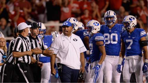 Scott Sommerdorf   |  The Salt Lake Tribune  
BYU head coach Kelani Sitake argues that his DB Kai Nacua should not have been ejected for targeting. Utah defeated BYU 20-19, Saturday, September 10, 2016.