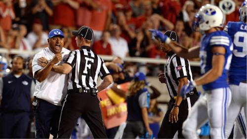 Scott Sommerdorf   |  The Salt Lake Tribune  
BYU head coach Kalani Sitake argues that his DB Kai Nacua should not have been ejected for targeting. Utah defeated BYU 20-19, Saturday, September 10, 2016.