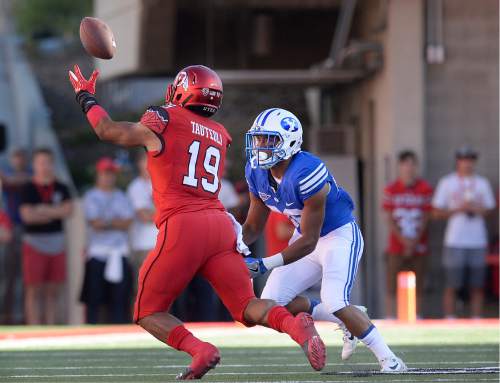 Scott Sommerdorf   |  The Salt Lake Tribune  
Utah LB Sunia Tauteoli grabs an interception after BYU WR Aleva Hifo bobbled the pass. Tauteoli rumbled 41 yards untouched for the TD on the game's opening play from scrimmage. Utah led BYU 7-6 after one quarter of play, Saturday, September 10, 2016.