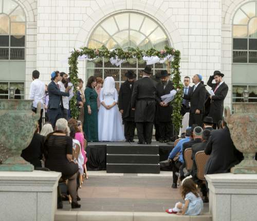 Rick Egan  |  The Salt Lake Tribune

Chaya Zippel and Rabbi Mendy Cohen are married at the Grand America on Monday, Sept. 12, 2016.