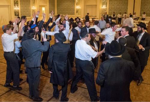 Rick Egan  |  The Salt Lake Tribune

Rabbi Mendy Cohen and the men dance during his traditional Hasidic wedding celebration at the Grand America after Cohen was married to Chaya Zippel on Monday, Sept. 12, 2016.
