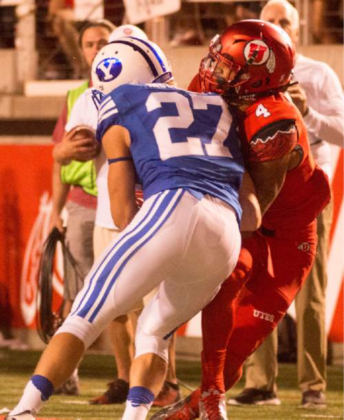 Rick Egan  |  The Salt Lake Tribune

Brigham Young Cougars defensive back Austin McChesney (27) was kicked out of the game for making contact withUtah Utes running back Troy McCormick (4) on this play, in football action, BYU vs. Utah, at Rice-Eccles Stadium, Saturday, September 10, 2016.