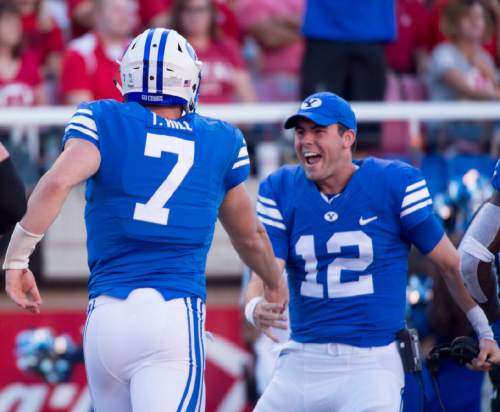 Rick Egan  |  The Salt Lake Tribune

Brigham Young quarterback Taysom Hill (7) is congratulated byTanner Mangum (12), after scoring a touchdown for the Cougars, in second quarter action, BYU vs. Utah at Rice-Eccles Stadium, Saturday, September 10, 2016.