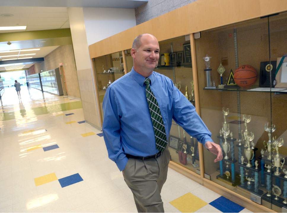 Al Hartmann  |  The Salt Lake Tribune
Wasatch Junior High School Principal John Anderson walk the halls Tuesday September 13.   The school earned enough points to get an "A" in school grading this year. But the school will actually receive a "B" grade because changes to the law make the grades more difficult when too many schools get "A"s or "B"s.