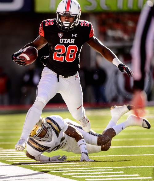 Trent Nelson  |  The Salt Lake Tribune
Utah Utes running back Joe Williams (28) is chased out of bounds by a UCLA defender as the University of Utah hosts UCLA, NCAA football at Rice-Eccles Stadium in Salt Lake City, Saturday November 21, 2015.