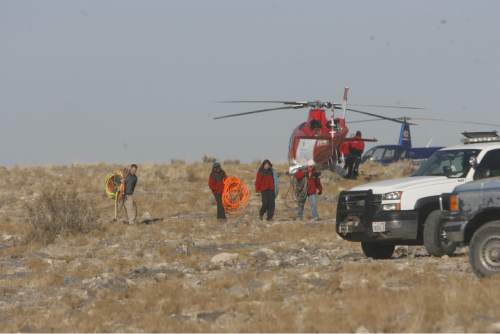 Al Hartmann  |  The Salt Lake Tribune

Crews work to rescue John Jones of Stansbury Park from the Nutty Putty Cave near Elberta in November 2009.