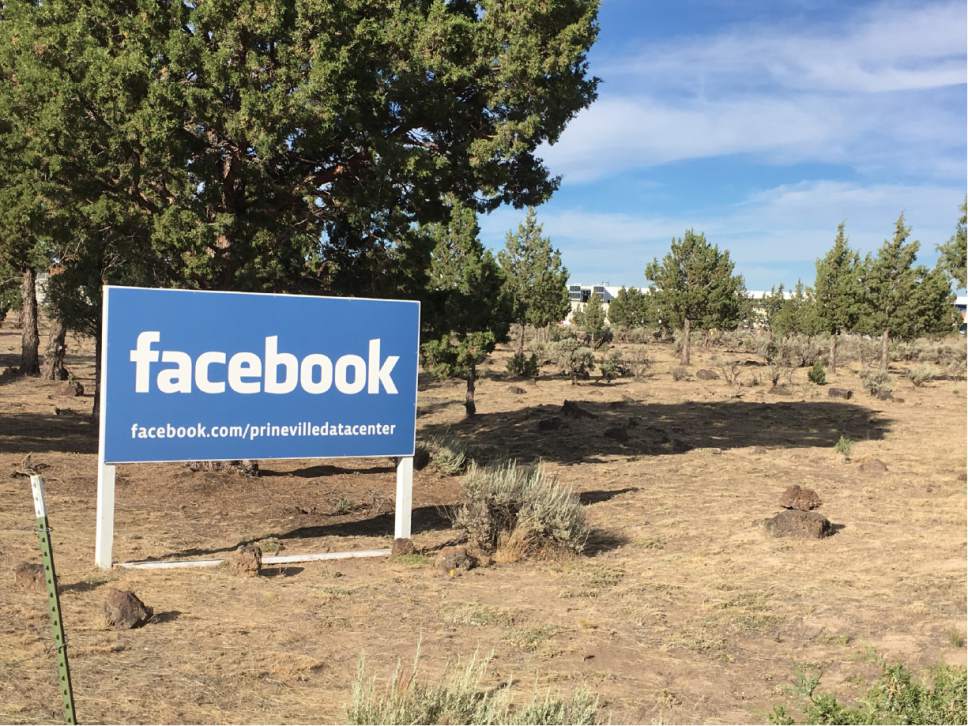 In this July 1, 2016 photo, a sign shows the entrance to the Facebook Data Center in Prineville, Ore. When timber was king, Crook County was the nation's top producer of ponderosa lumber. But with the catastrophic decline in the timber industry, and the global recession after that, suddenly the digital revolution is providing the county and its main town, Prineville, with a rare second chance. (AP Photo/Andrew Selsky)