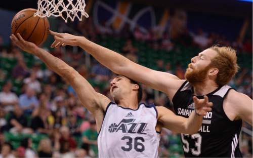 Steve Griffin / The Salt Lake Tribune

Utah Jazz guard Aaron Craft gets knocked in the head by Spurs center Alex Kirk  during the Jazz versus Spurs summer league game at the Vivint Smart Home Arena in Salt Lake City Monday July 4, 2016.