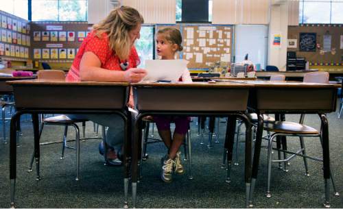 Steve Griffin / The Salt Lake Tribune


First grade teacher Heidi Baer works with Edie Wood on a story she had written during class at Howard Driggs Elementary in Holladay Thursday September 15, 2016.