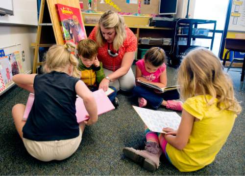 Steve Griffin / The Salt Lake Tribune


First grade teacher Heidi Baer helps students with their reading during class at Howard Driggs Elementary in Holladay Thursday September 15, 2016.