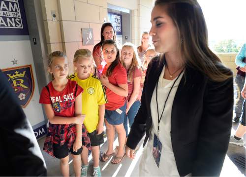 Scott Sommerdorf   |  The Salt Lake Tribune  
A group of youth soccer players who were getting a tour of the stadium, were in awe Carla Swensen Haslam as she stopped to talk to them on the way to the broadcast booth,  Friday, September 9, 2016. Carla Swensen Haslam, a junior forward on the nationally-ranked BYU women's soccer team, also serves as the color commentator on the broadcast for Real Monarchs matches.