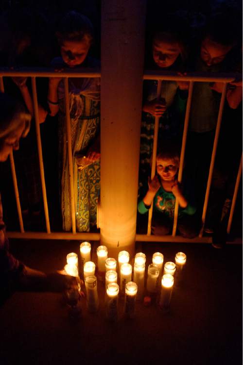 Trent Nelson  |  The Salt Lake Tribune
Children look at candles as residents of Hildale, UT and Colorado City, AZ, hold a memorial to the victims of the 2015 flash flood that , Wednesday September 14, 2016.