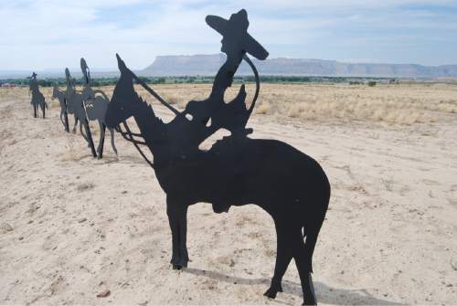 Brian Maffly  |  The Salt Lake Tribune

Metal cutouts, created by Cleveland sculptor Eldon Holmes, depict a mule pack train that would have used the Old Spanish Trail from 1829 and 1848. Explorers and traders traveled this network of routes across southern Utah between the Mexican outposts of Santa Fe and Los Angeles. The cutouts were installed this summer at the east entrance to the Green River, Utah.