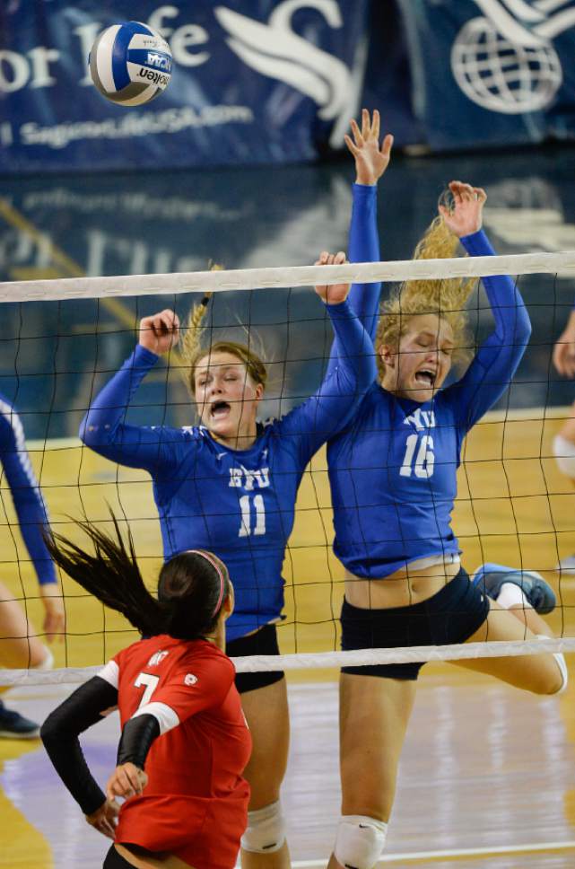 Francisco Kjolseth | The Salt Lake Tribune
BYU's #11 Lacy Haddock and #16 Whitney Young Howard put the defensive pressure on Utah's Eliza Katoa in women's volleyball at the Smith Fieldhouse in Provo on Thursday, Sept. 15, 2016.