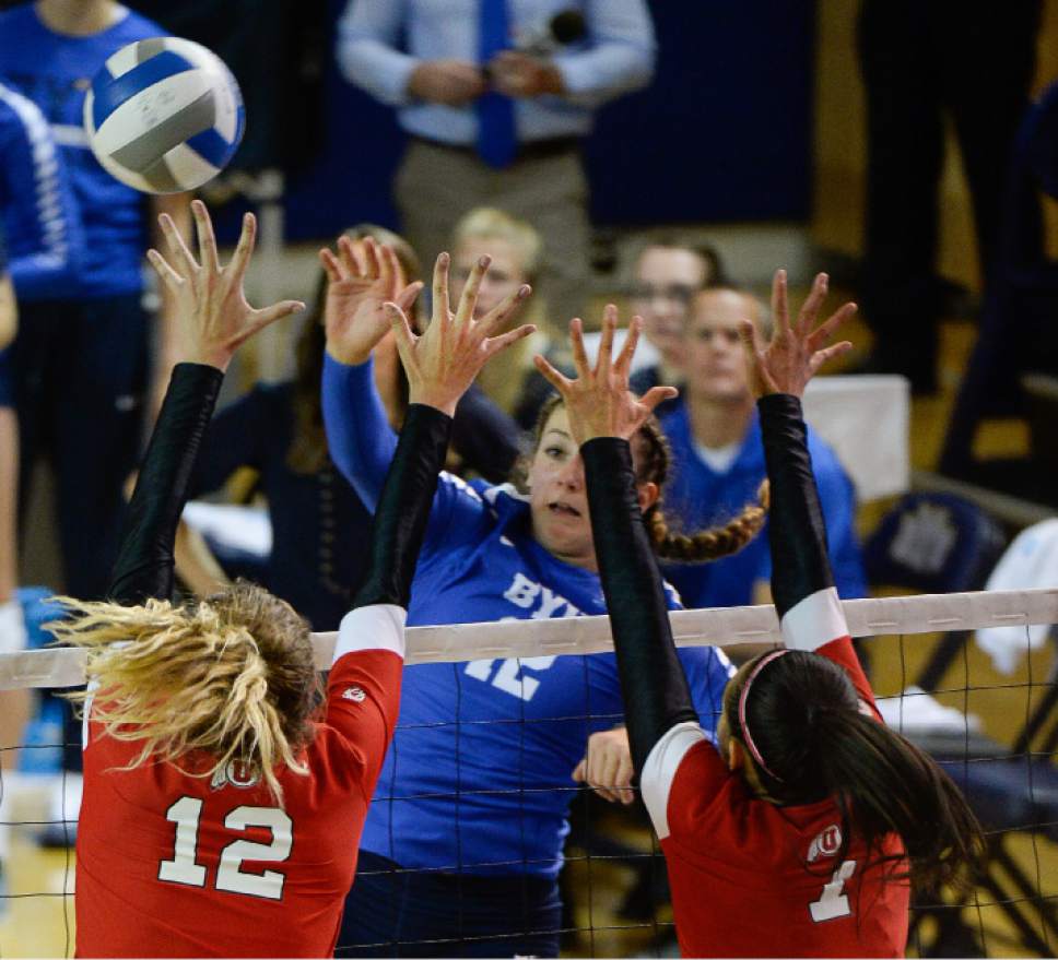 Francisco Kjolseth | The Salt Lake Tribune
BYU's Roni Jones-Perry battles the wall of defense put on by Utah's #12 Berkley Oblad and #7 Eliza Katoa in women's volleyball at the Smith Fieldhouse in Provo on Thursday, Sept. 15, 2016.