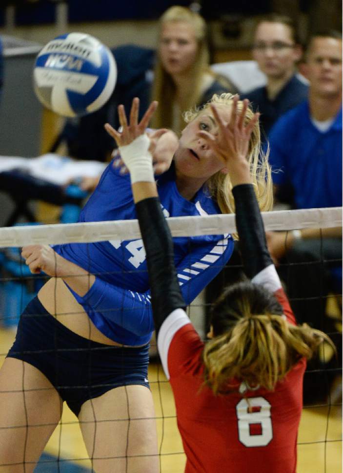 Francisco Kjolseth | The Salt Lake Tribune
BYU's McKenna Miller spikes one past Utah's Bailer Choy in women's volleyball at the Smith Fieldhouse in Provo on Thursday, Sept. 15, 2016.