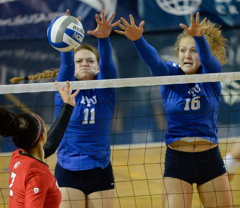 Francisco Kjolseth | The Salt Lake Tribune
BYU's #11 Lacy Haddock and #16 Whitney Young Howard put the defensive pressure on Utah's Eliza Katoa in women's volleyball at the Smith Fieldhouse in Provo on Thursday, Sept. 15, 2016.