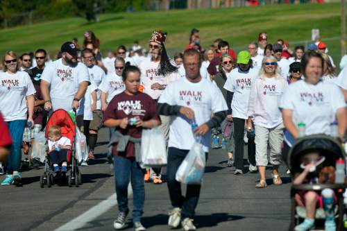 Chris Detrick  |  The Salt Lake Tribune
Participants go along 11th Avenue during Shriners Hospitals for Children "Walk & Roll for Love" Saturday September 17, 2016.