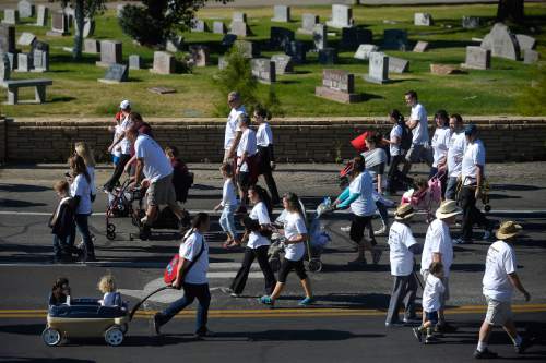 Chris Detrick  |  The Salt Lake Tribune
Participants go along 11th Avenue during Shriners Hospitals for Children "Walk & Roll for Love" Saturday September 17, 2016.