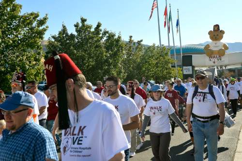 Chris Detrick  |  The Salt Lake Tribune
Participants go to 11th Avenue during Shriners Hospitals for Children "Walk & Roll for Love" Saturday September 17, 2016.