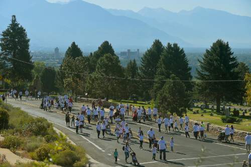 Chris Detrick  |  The Salt Lake Tribune
Participants go along 11th Avenue during Shriners Hospitals for Children "Walk & Roll for Love" Saturday September 17, 2016.