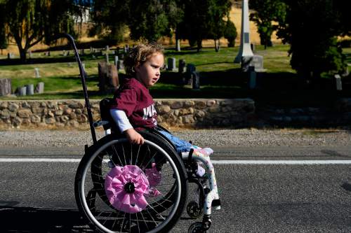 Chris Detrick  |  The Salt Lake Tribune
Penny Pedersen, 4, of Salt Lake City, goes along 11th Avenue during Shriners Hospitals for Children ìWalk & Roll for Loveî on Saturday.
