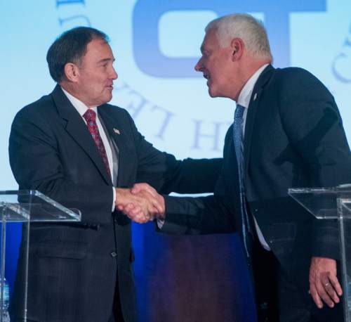 Rick Egan   |   The Salt Lake Tribune
Gov. Gary Herbert shakes hands with Mike Weinholtz, after their debate, during the Utah League of Cities and Towns annual conference at the Sheraton, in Salt Lake City, Friday, September 16, 2016.