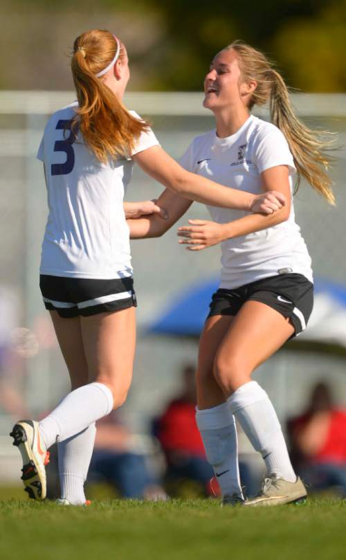 Leah Hogsten  |  The Salt Lake Tribune
Tooele's Sydney Russell celebrates teammate McKenna Banks' goal during their win against Union High School, 6-0, September 16, 2016. Tooele High School girls' soccer team has never won a state title, in fact the Buffaloes have rarely even had a winning season. That's what has made this season so special. Under the direction of head coach Stephen Duggan, Tooele is off to a 7-1-2 start, and feeling very much like a title contender for once.