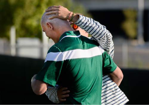 Francisco Kjolseth | The Salt Lake Tribune
Friend and former teammate, Tyler Brown, rubs the bald head of Austin Buxton who lost his hair during recent chemo treatments for cancer. Three days before UVU's season opener against the University of Washington, UVU soccer player Austin Buxton found out that his cancer had returned and he would miss the season to undergo chemotherapy. Now, with the Wolverines in the Top 25 nationally, his teammates are rallying around him.