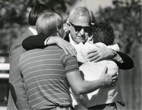 Tribune file photo
J. Gary Sheets, center, is comforted by his daughter, Katie Robertson, after arriving at his Salt Lake City home where his wife had been killed in a bomb explosion.