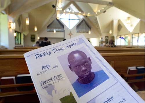 Scott Sommerdorf   |  The Salt Lake Tribune  
The funeral service program for 36-year-old Philip Aguto, at All Saints Episcopal Church, Sunday, August 28, 2016. Aguto was killed in a hit-and-run accident. in mid-August. He was part of the 20,000 Lost Boys of Sudan, and came to the U.S. in 2001, later becoming a citizen.