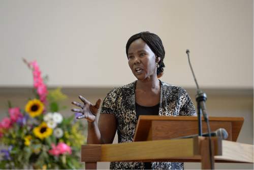 Scott Sommerdorf   |  The Salt Lake Tribune  
Nya Deng speaks at the memorial service for 36-year-old Philip Aguto, Sunday, August 28, 2016. Aguto was killed in a hit-and-run accident. in mid-August. He was part of the 20,000 Lost Boys of Sudan, and came to the U.S. in 2001, later becoming a citizen.