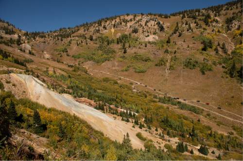 Leah Hogsten  |  The Salt Lake Tribune
The white hillsides of Mary Ellen Gulch show the tailings from the Live Yankee mine, September 13, 2016. The headwaters of American Fork Canyon is full of a dozen or so abandoned mines that environmentalists and county leaders say is threatening the precious watershed. Members of Protect and Preserve American Fork Canyon led a tour of the remains of the Live Yankee mine.  Water discharging from the mine has contaminated the stream and filled Tibble Fork reservoir with sediments rich in lead and arsenic.