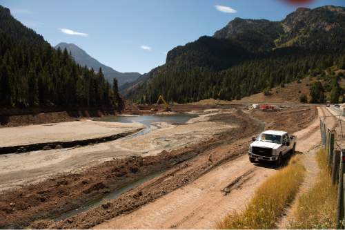 Leah Hogsten  |  The Salt Lake Tribune
Water discharge from the Live Yankee mine located in Mary Ellen Gulch has been re-routed around Tibble Fork reservoir so construction of the expanded dam could proceed, September 13, 2016 to make the dam seismically safe and extend its life for another 50 years. The lake bed sediment, loaded with arsenic, lead and other toxic metals from historical mining operations at the scenic canyon's headwaters, was too costly for removal, so the option was abandoned in favor of raising the dam by 9 feet. Although irrigation is the main and historic use of the reservoir, Utahns use the canyon for recreation and play in the streambed.  The headwaters of American Fork is perforated with abandoned mines that environmentalists and county leaders say is threatening the precious watershed.