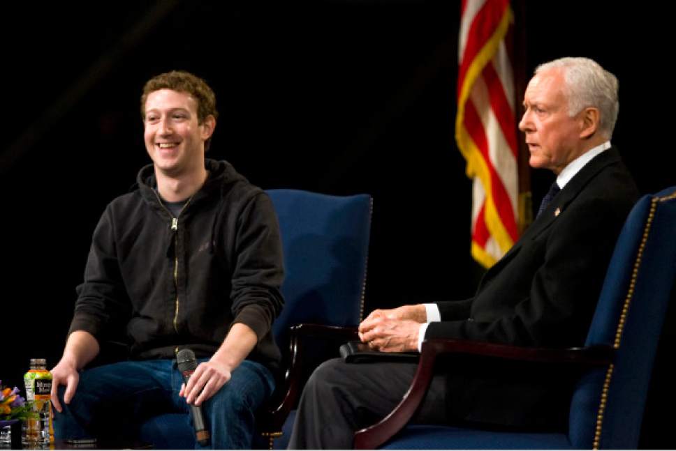 Al Hartmann   |  Tribune file photo 

Facebook founder Mark Zuckerberg, left, is targeting Utah Sen. Orrin Hatch with advertising supporting immigration reform. They are seen here at a BYU technology forum in March 2011.