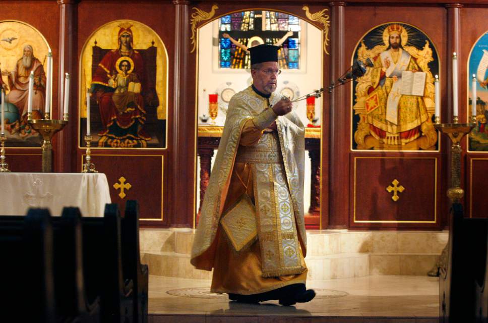 Scott Sommerdorf  |  The Salt Lake Tribune         
Members of the Greek Orthodox Church of Greater Salt Lake's 
Holy Trinity Cathedral and Prophet Elias Church are mourning a diagnosis of late-stage bone cancer for their senior clergyman, priest Matthew Gilbert.
In this June, 2012 file photo, Rev. Matthew Gilbert conducts service in his vestments at Holy Trinity Greek Orthodox Cathedral in Salt Lake City/